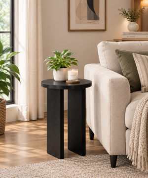 Black round end table beside sofa