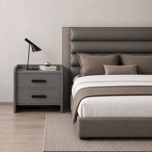 Modern solid wood bedside table with 2 drawers placed beside a bed in a contemporary bedroom, providing stylish storage and functional bedside organization.