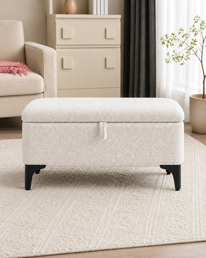 Modern white storage ottoman bench with upholstered seat and black tapered legs
