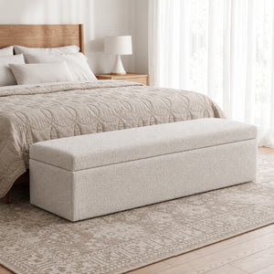 White upholstered storage ottoman bench side view