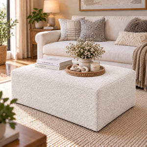 White upholstered storage ottoman
