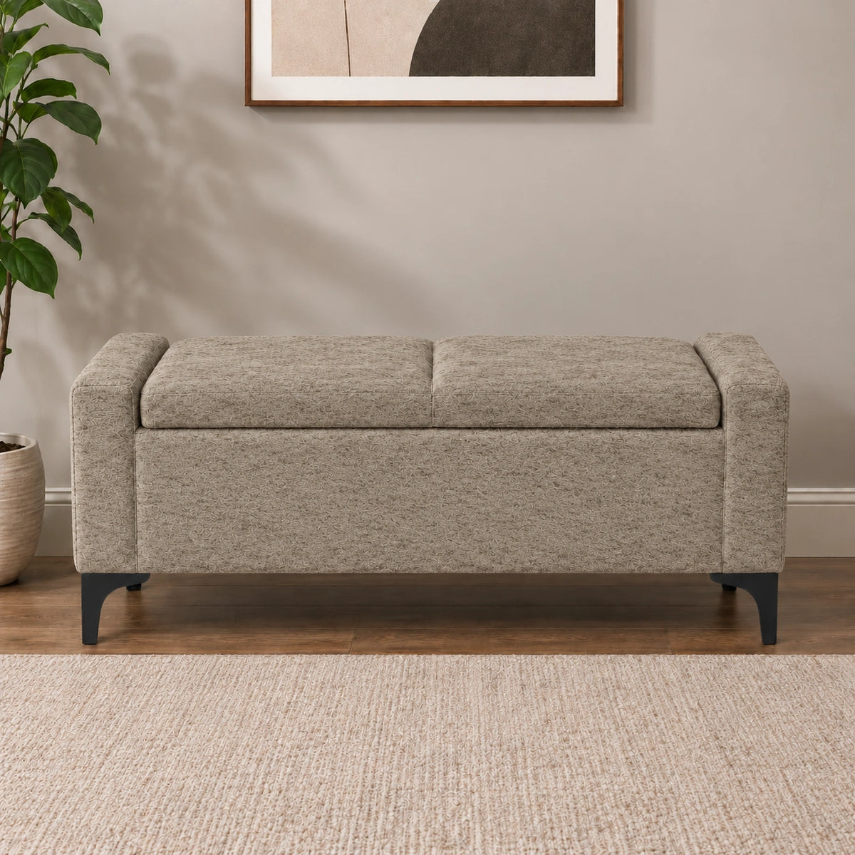 Beige upholstered storage ottoman bench with cushioned top and black legs