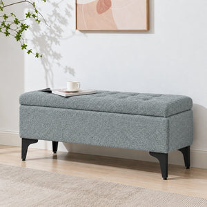 blue grey storage ottoman bench in a modern bedroom