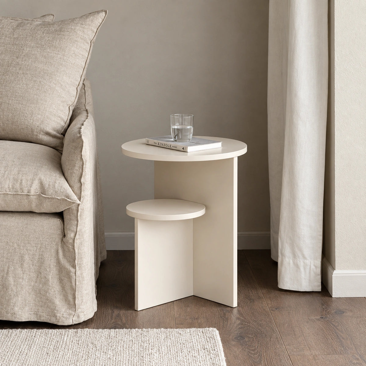 Cream round side table beside sofa in living room