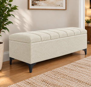 Cream tufted storage bench with black legs side view