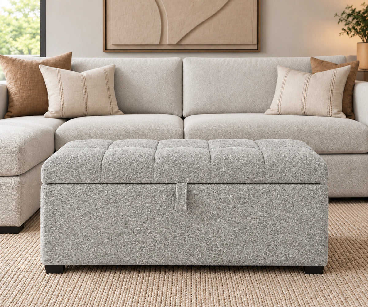 Light grey tufted storage ottoman with lift-up top