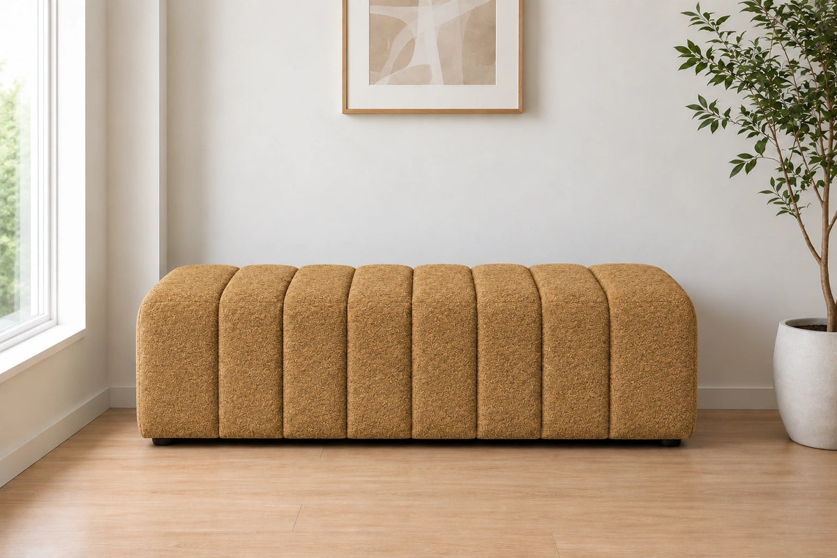 Mustard brown upholstered ottoman with channel tufted design