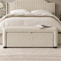 Off-white storage ottoman bench at the foot of a modern bedroom
