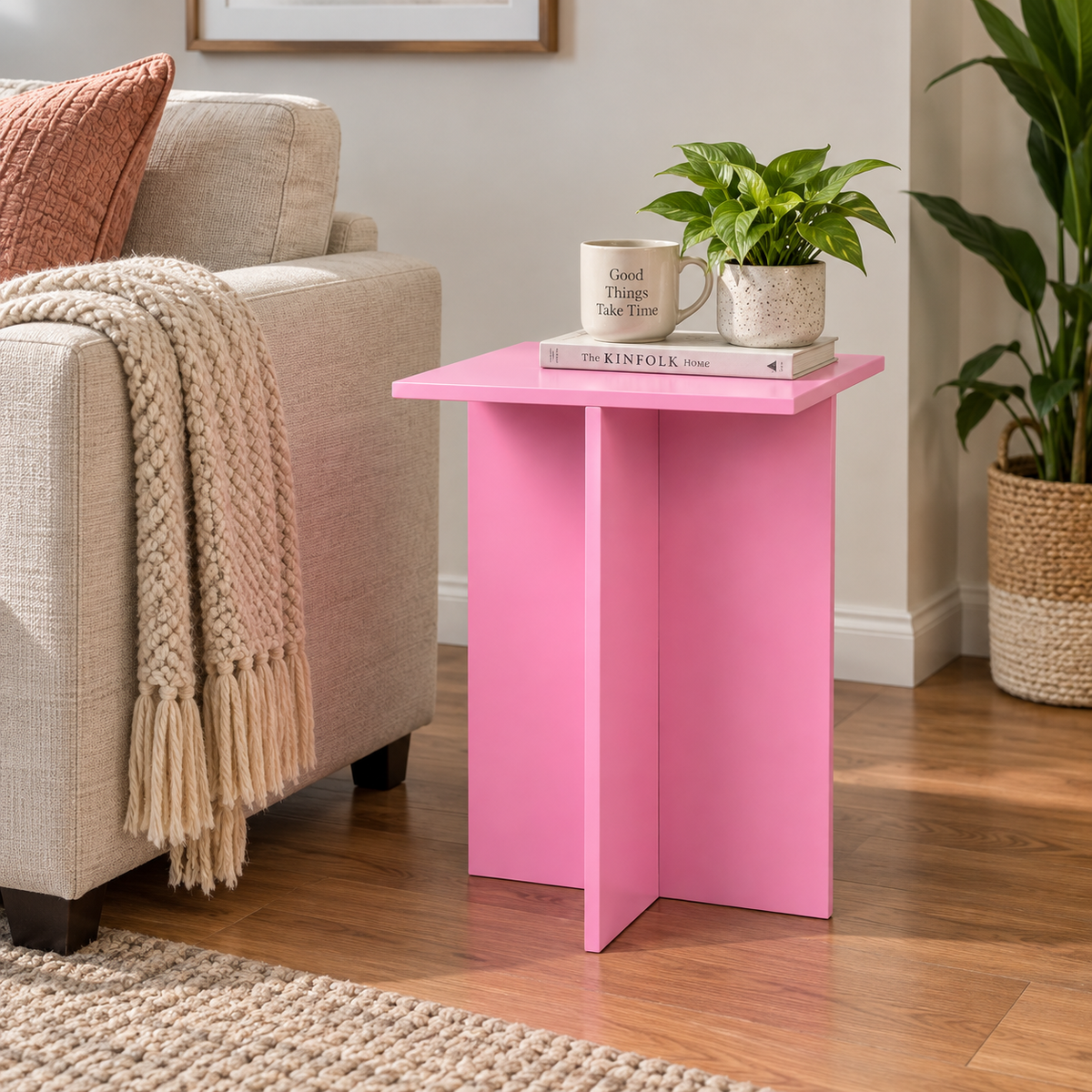Pink end table beside sofa