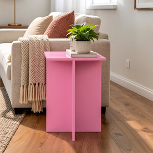 Pink end table beside sofa