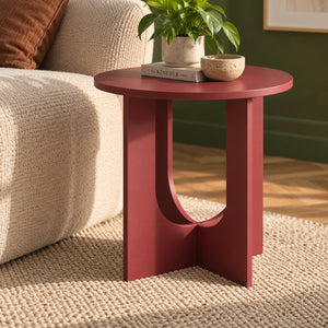 Round maroon end table in living room