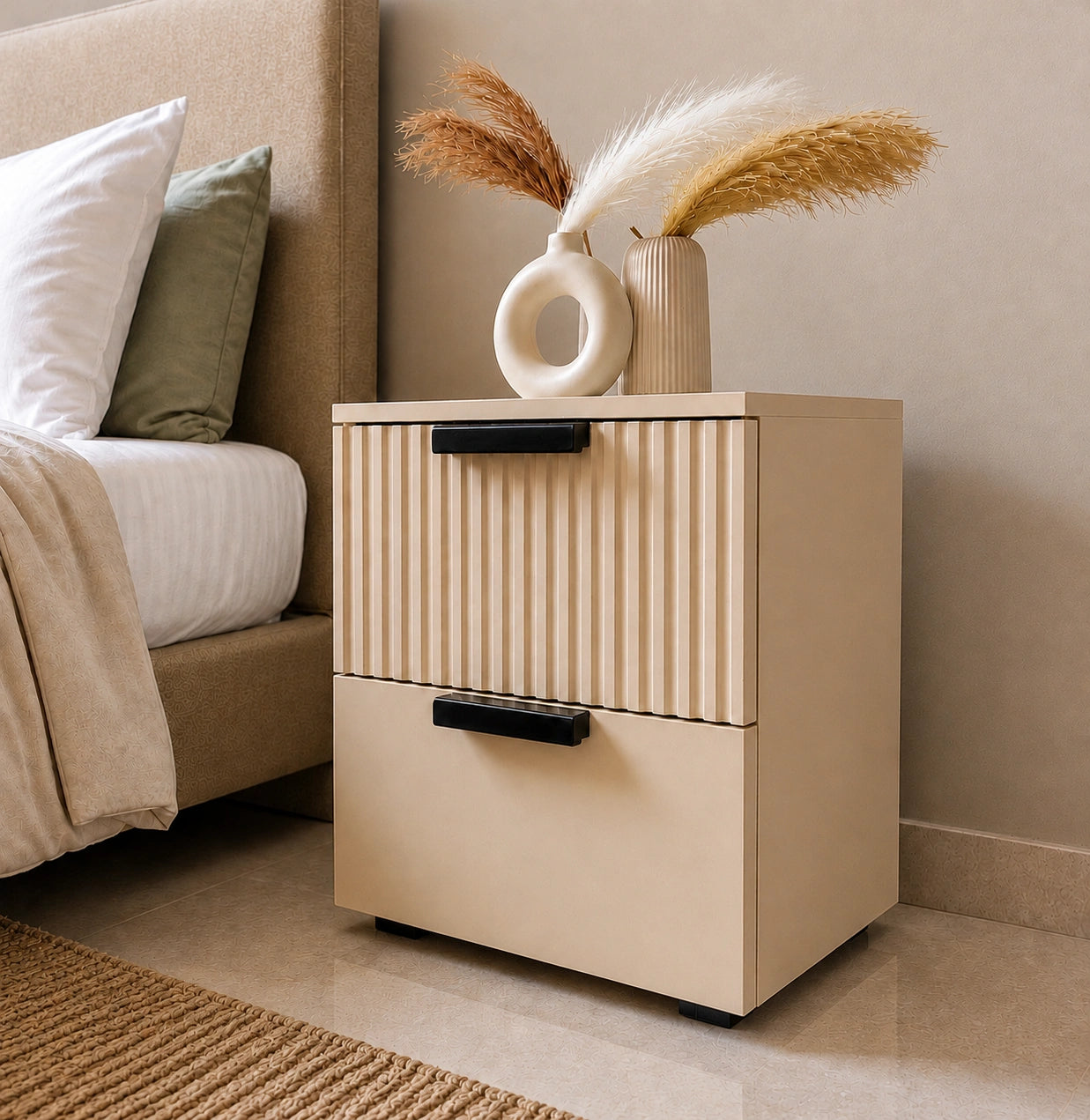 Modern Solid Wood bedside table with two drawers and fluted front panel beside a luxury bedroom bed.