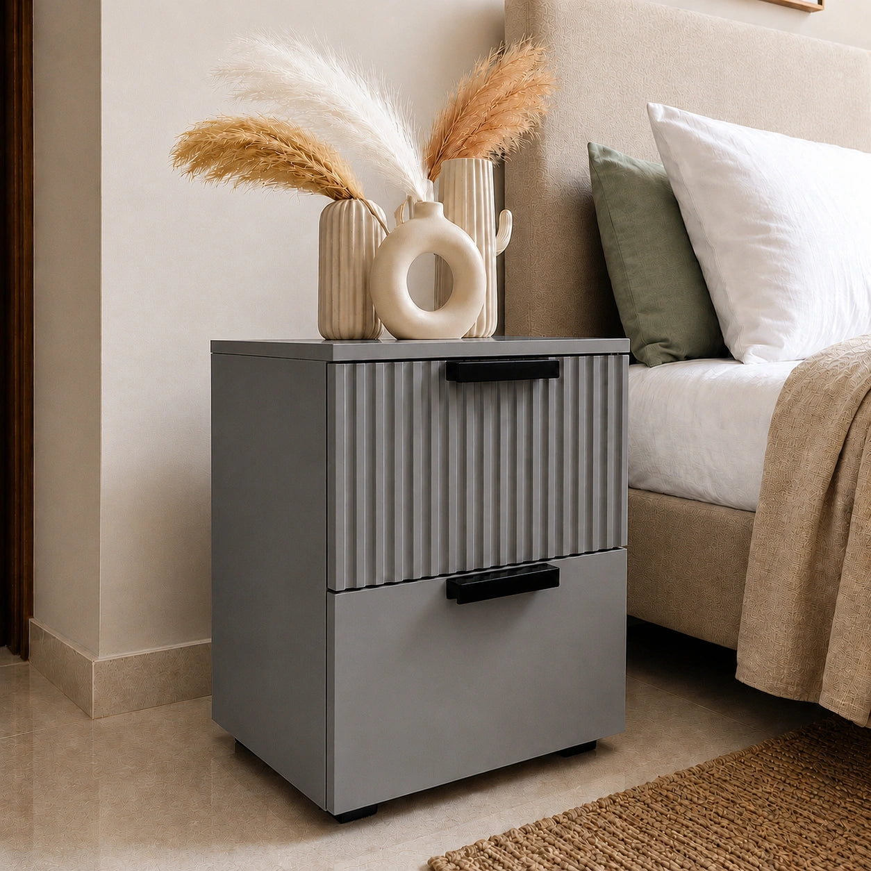 Premium Grey Solid Wood bedside table featuring fluted drawer fronts and spacious storage beside a luxury bed.